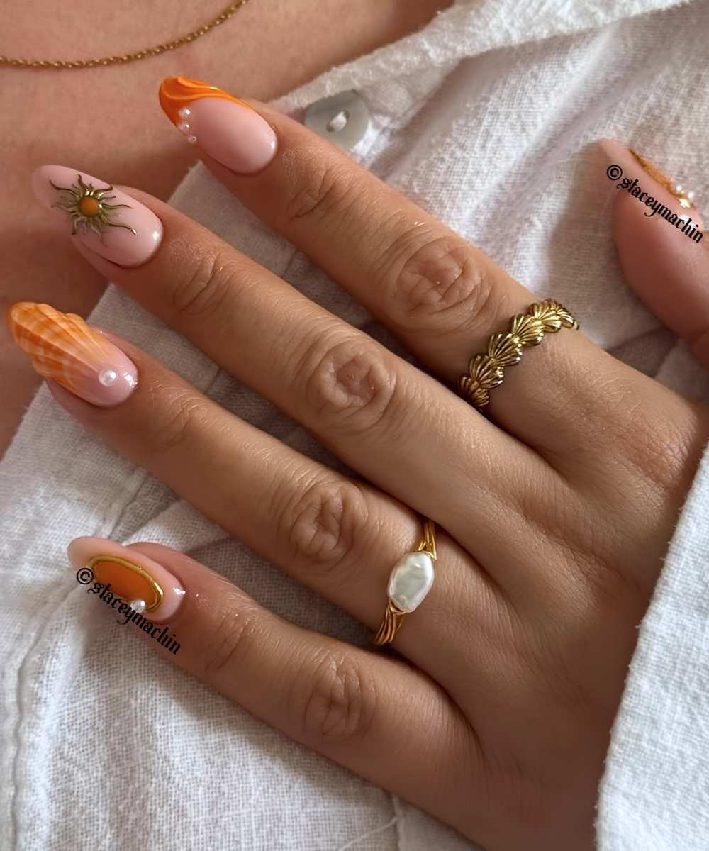 Orange summer nails with pearls and shells