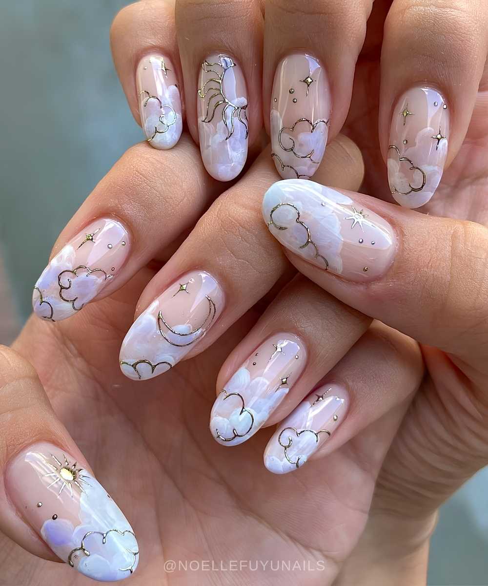 Pastel cloud nails with metallic celestial accents