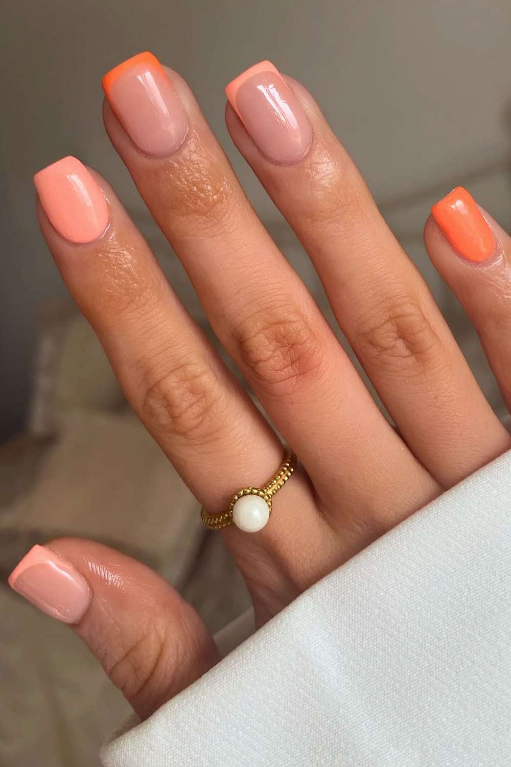 Peach and orange mani with accent French tips