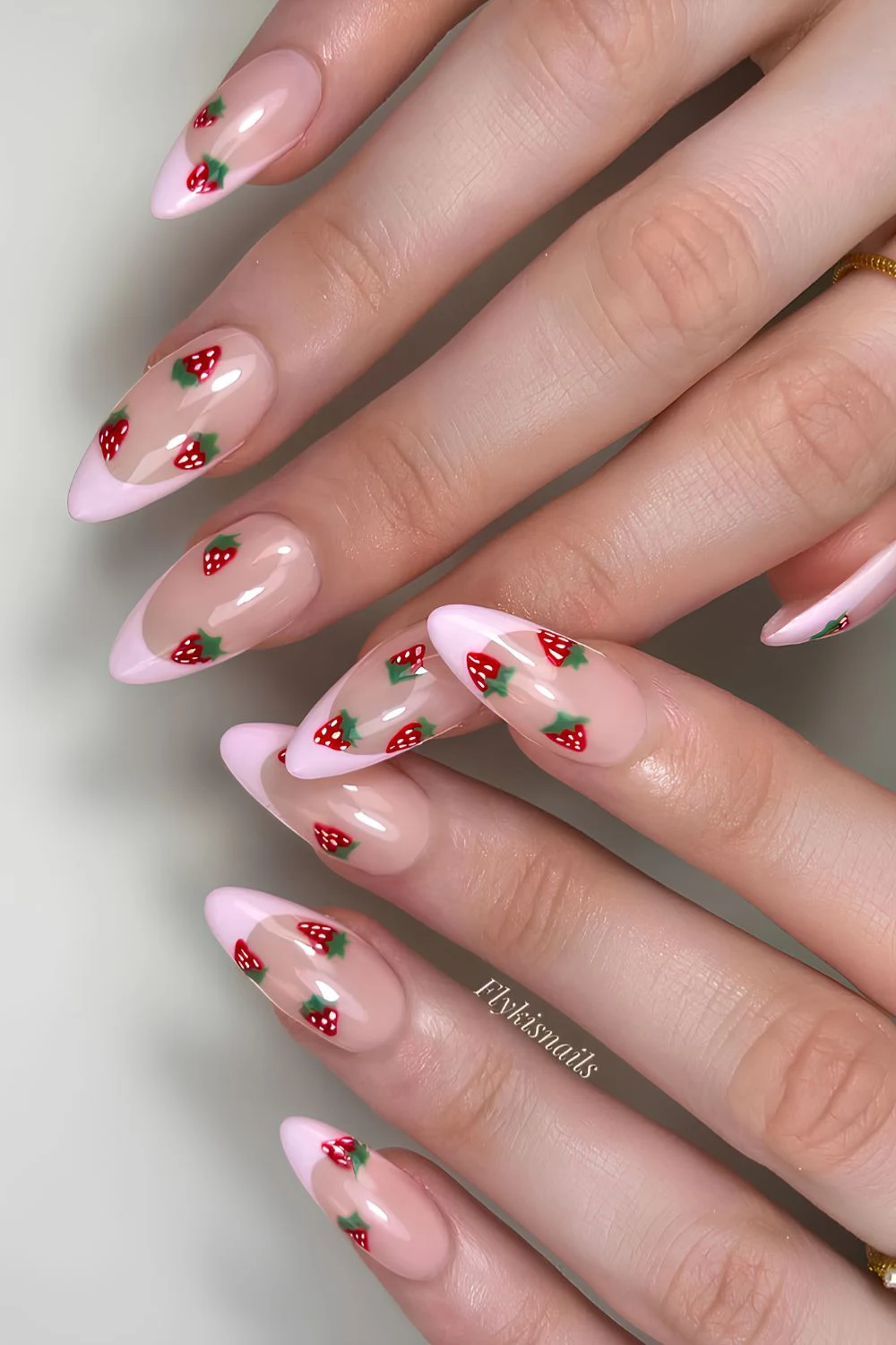 Pink French manicure with strawberry