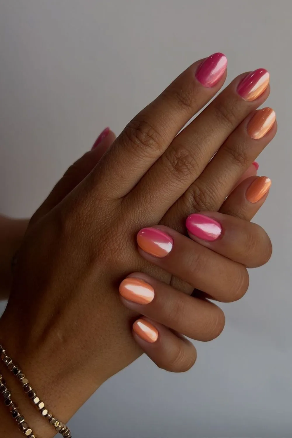 Pink and orange chrome nails