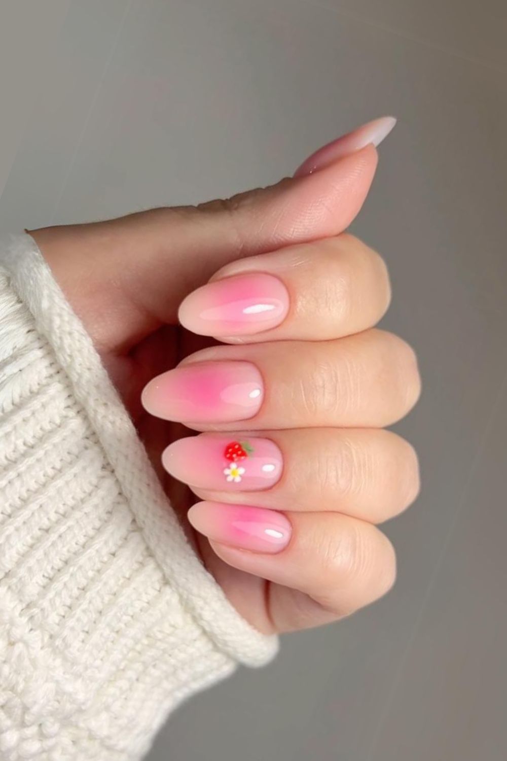 Pink blush nails with strawberry design