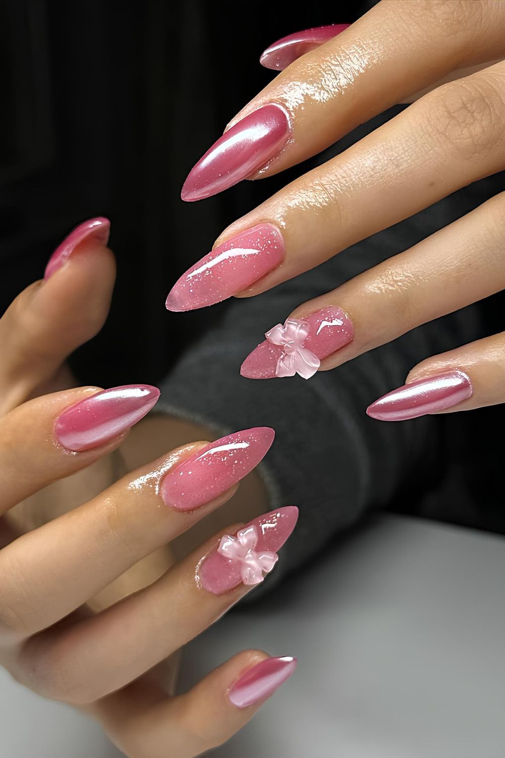 Pink chrome nails with 3D bows