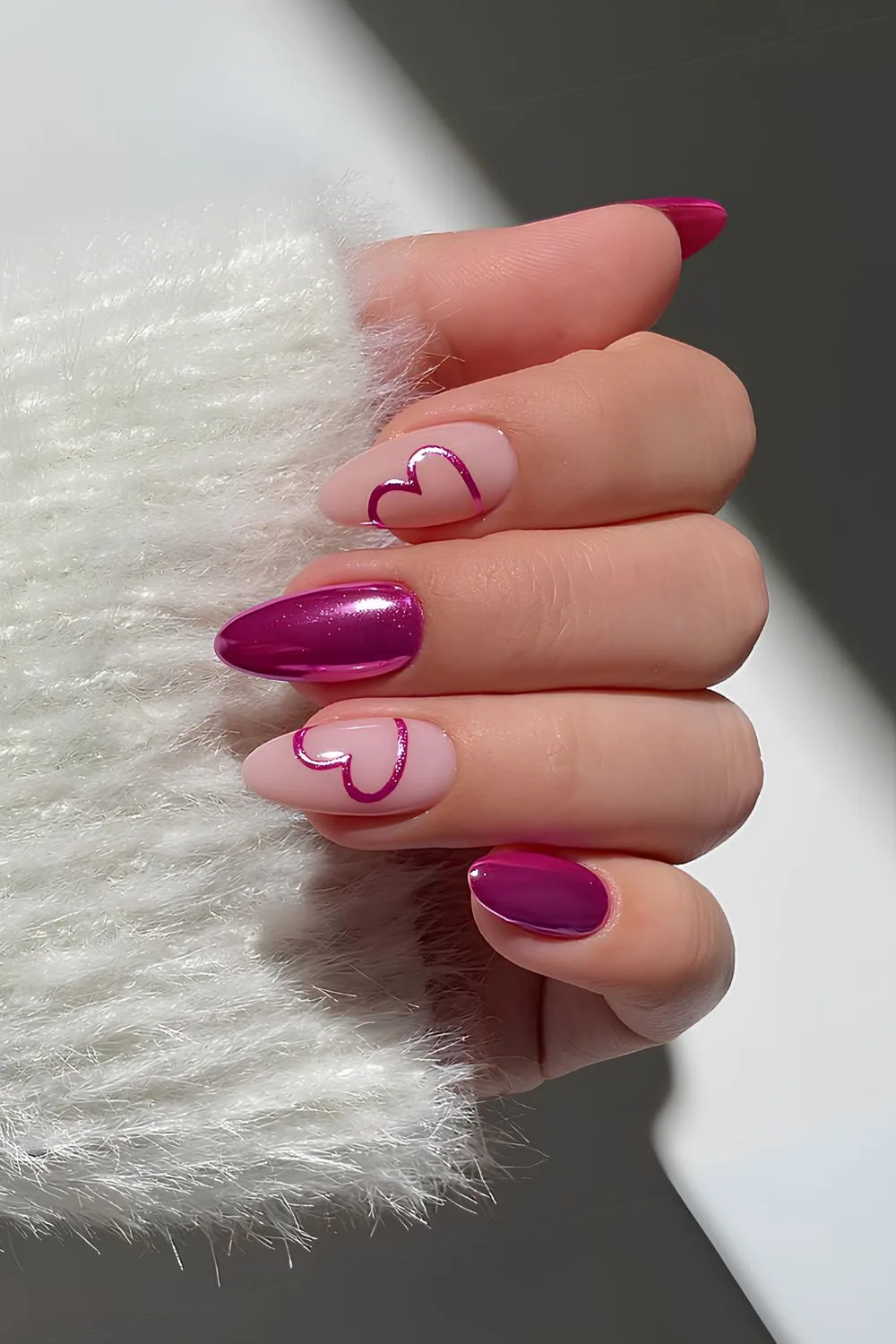 Pink chrome nails with bows and pearls