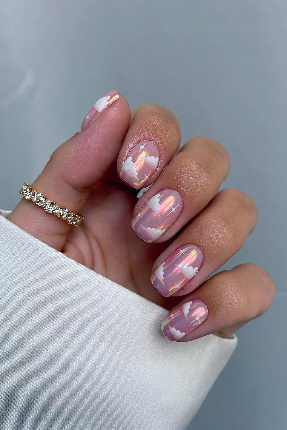 Pink chrome nails with clouds