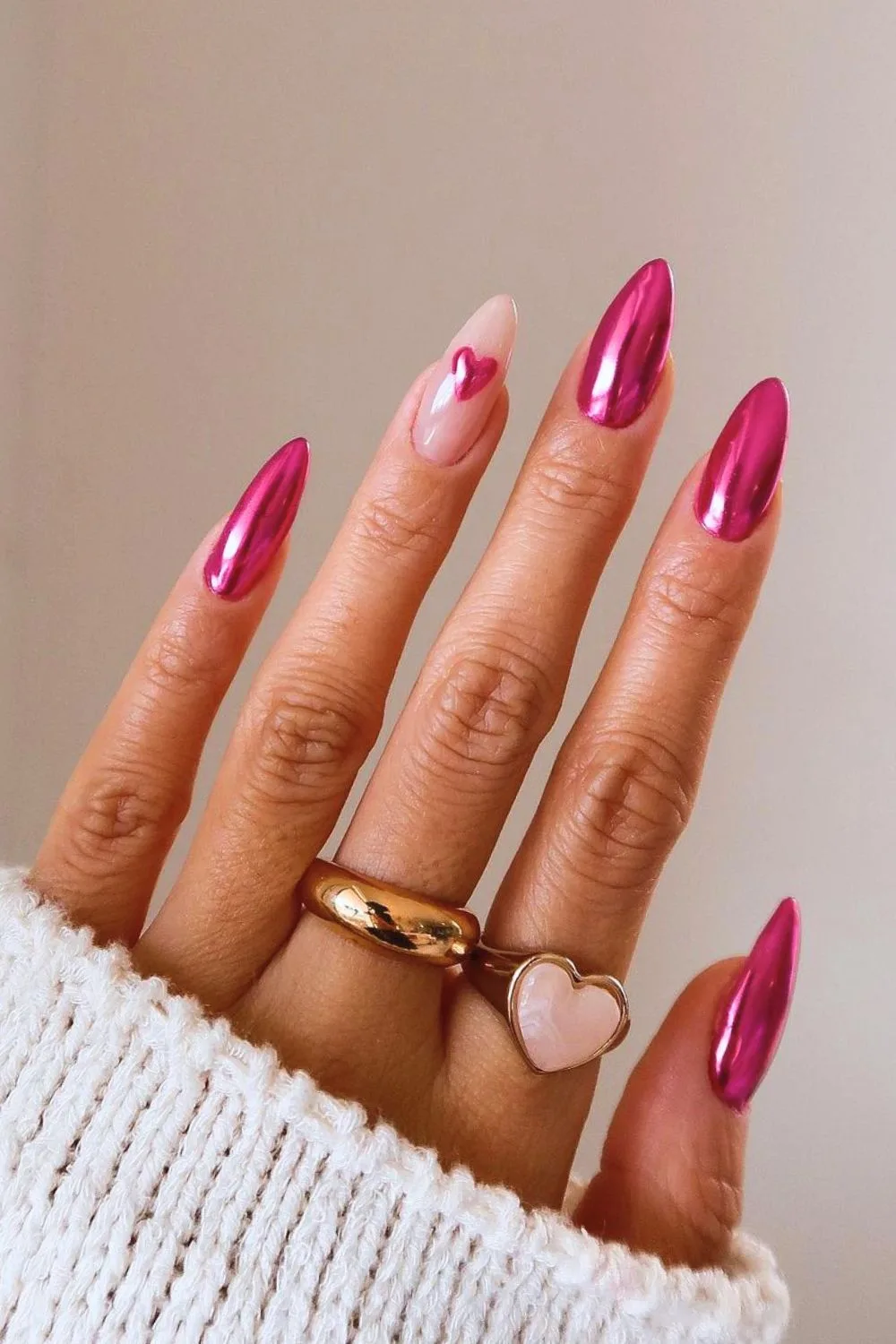 Pink chrome nails with heart accent