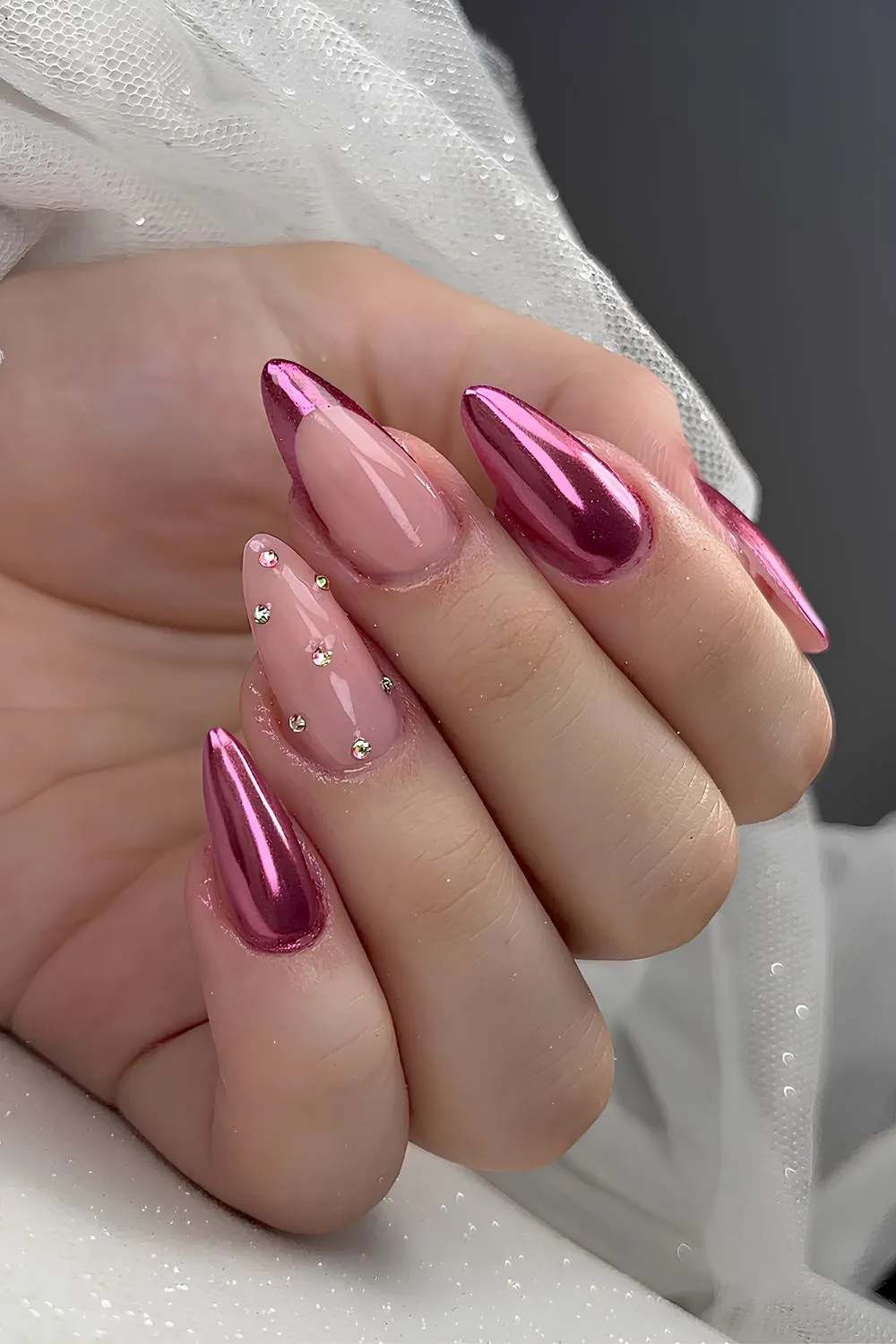 Pink chrome nails with rhinestones