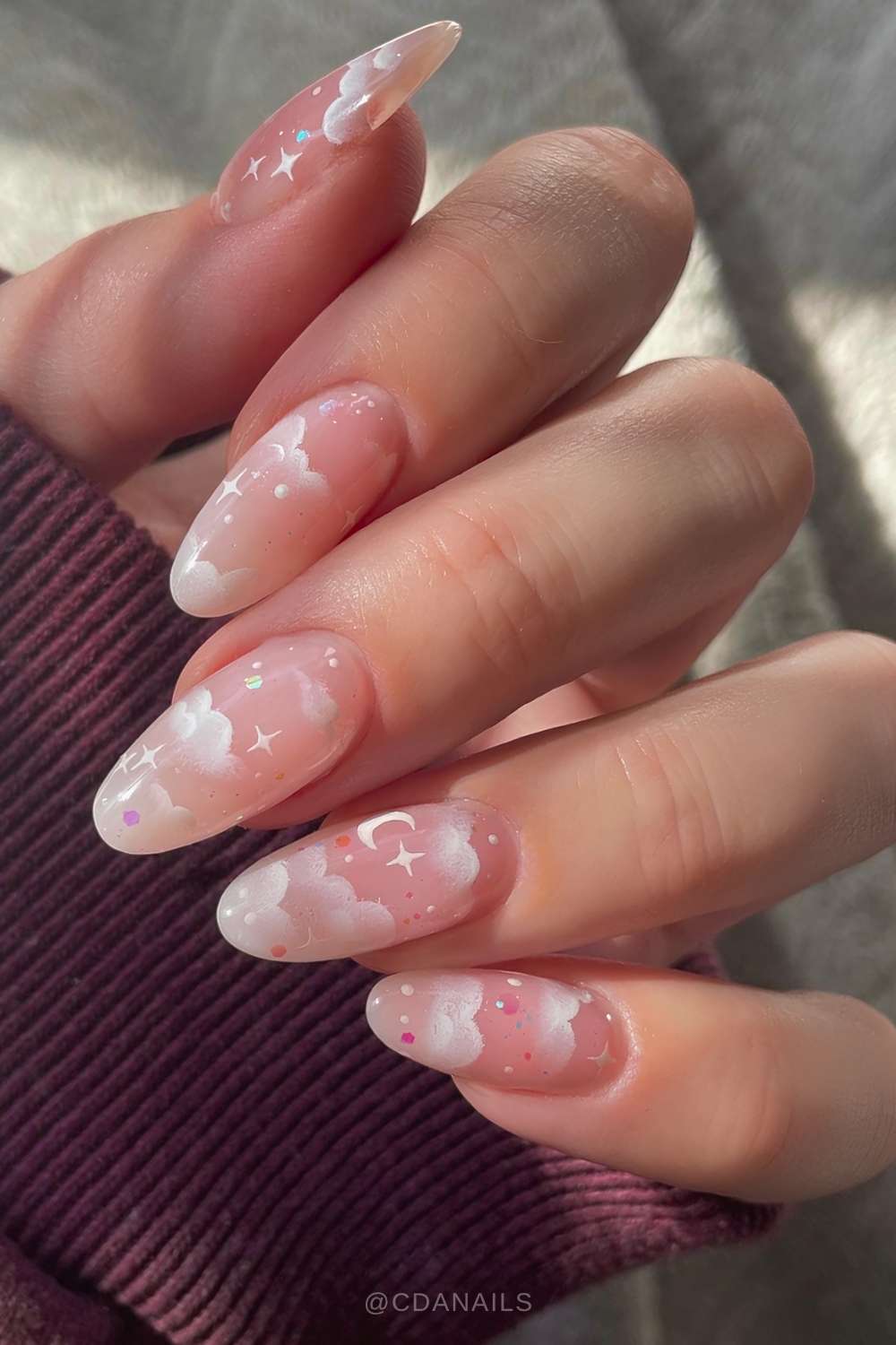 Pink jelly mani with white cloud and star art
