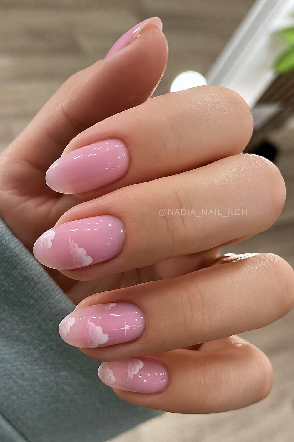 Pink nails with delicate cloud art