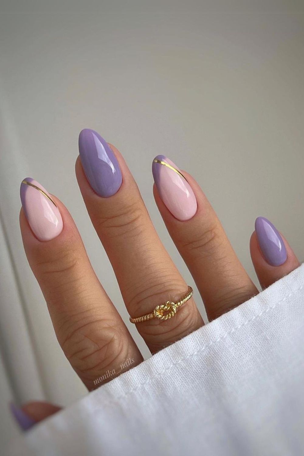 Purple nails with gold accent lines