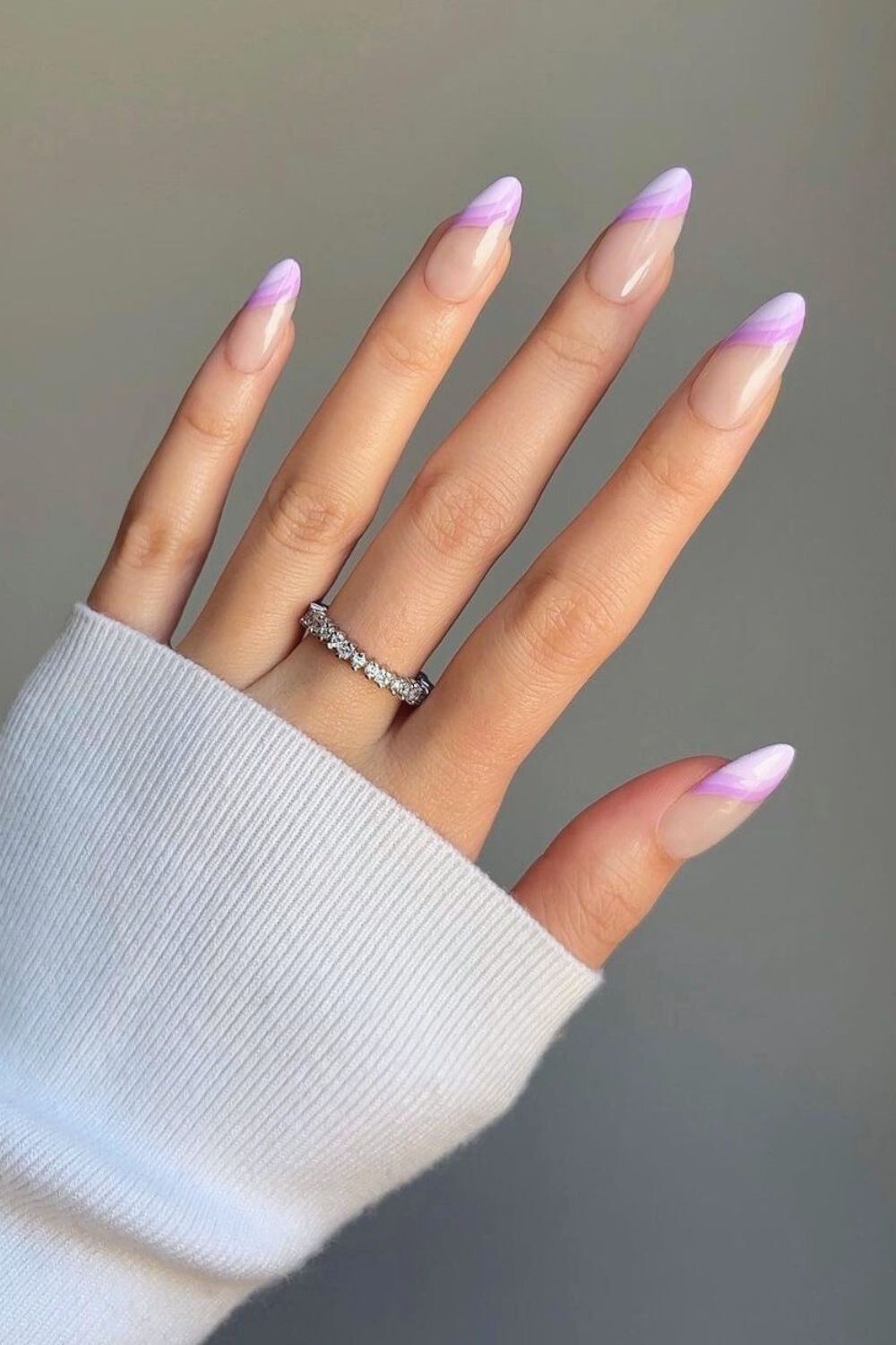 Purple swirled french tip nails