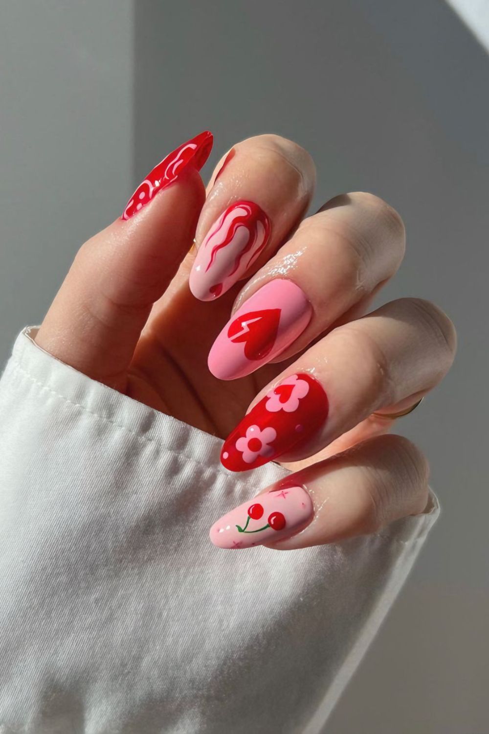 Red and pink mismatched nails