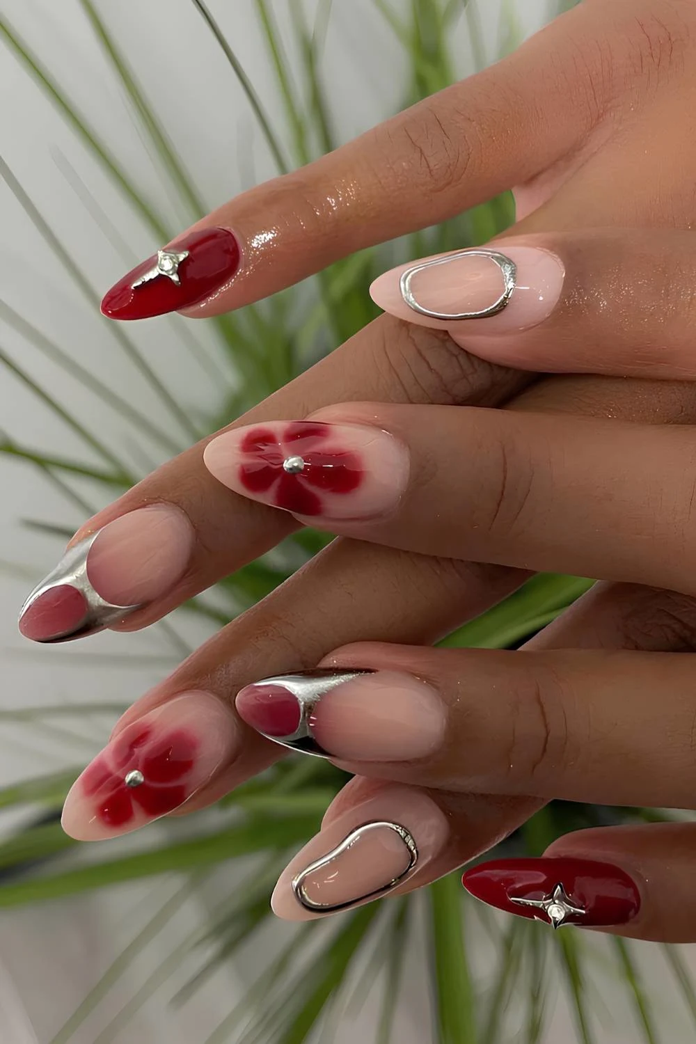 Red mix and match nails with silver accents