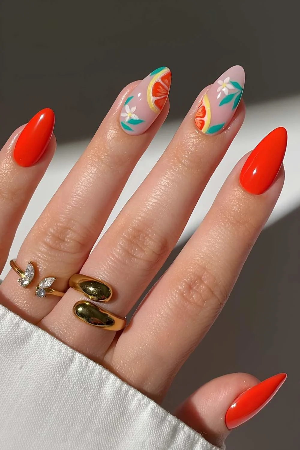 Red nails with grapefruit art