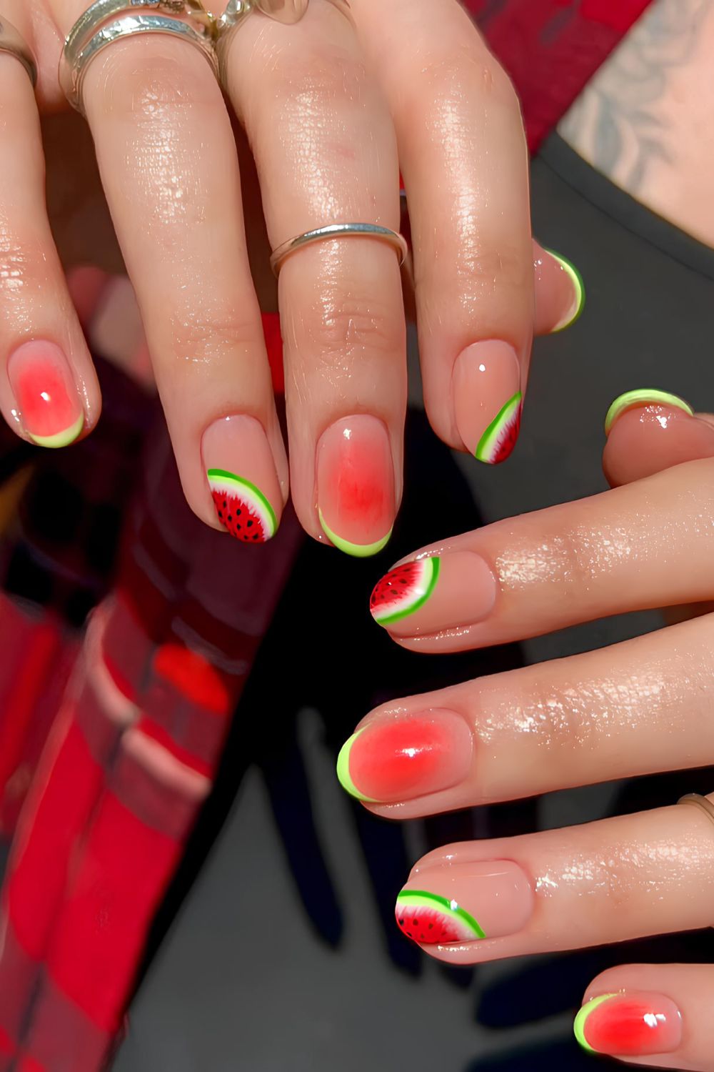 Red nails with green and watermelon accents