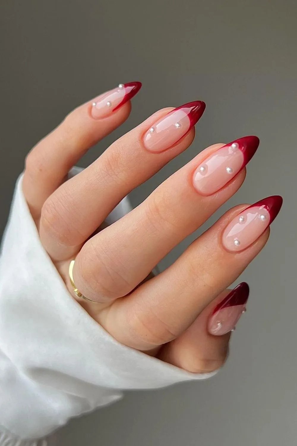 Red nails with pearls