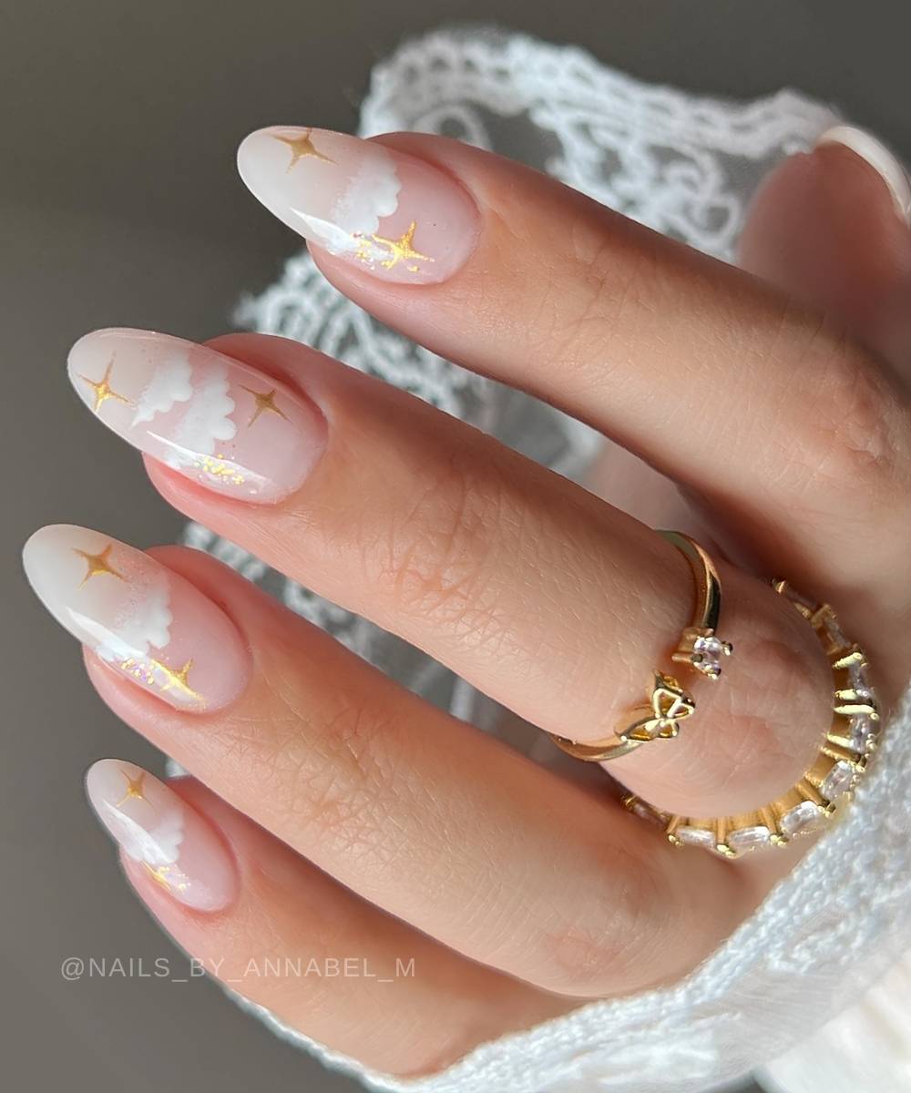 Sheer white mani with clouds and gold star art