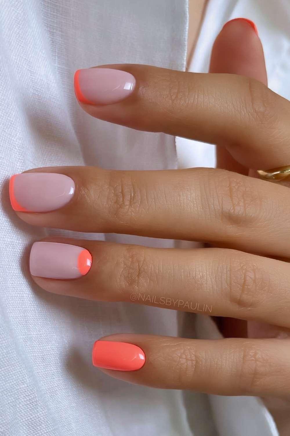 Short coral orange mani with accent French tips