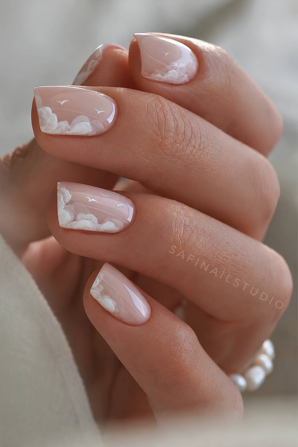 Short white mani with cloud and bird art