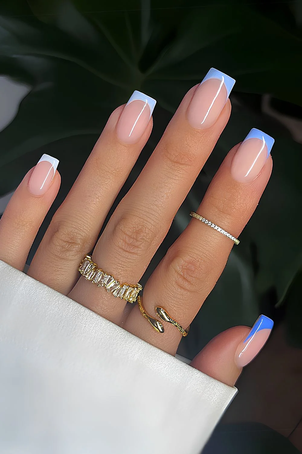 Skittle French nails in different shades of light blue