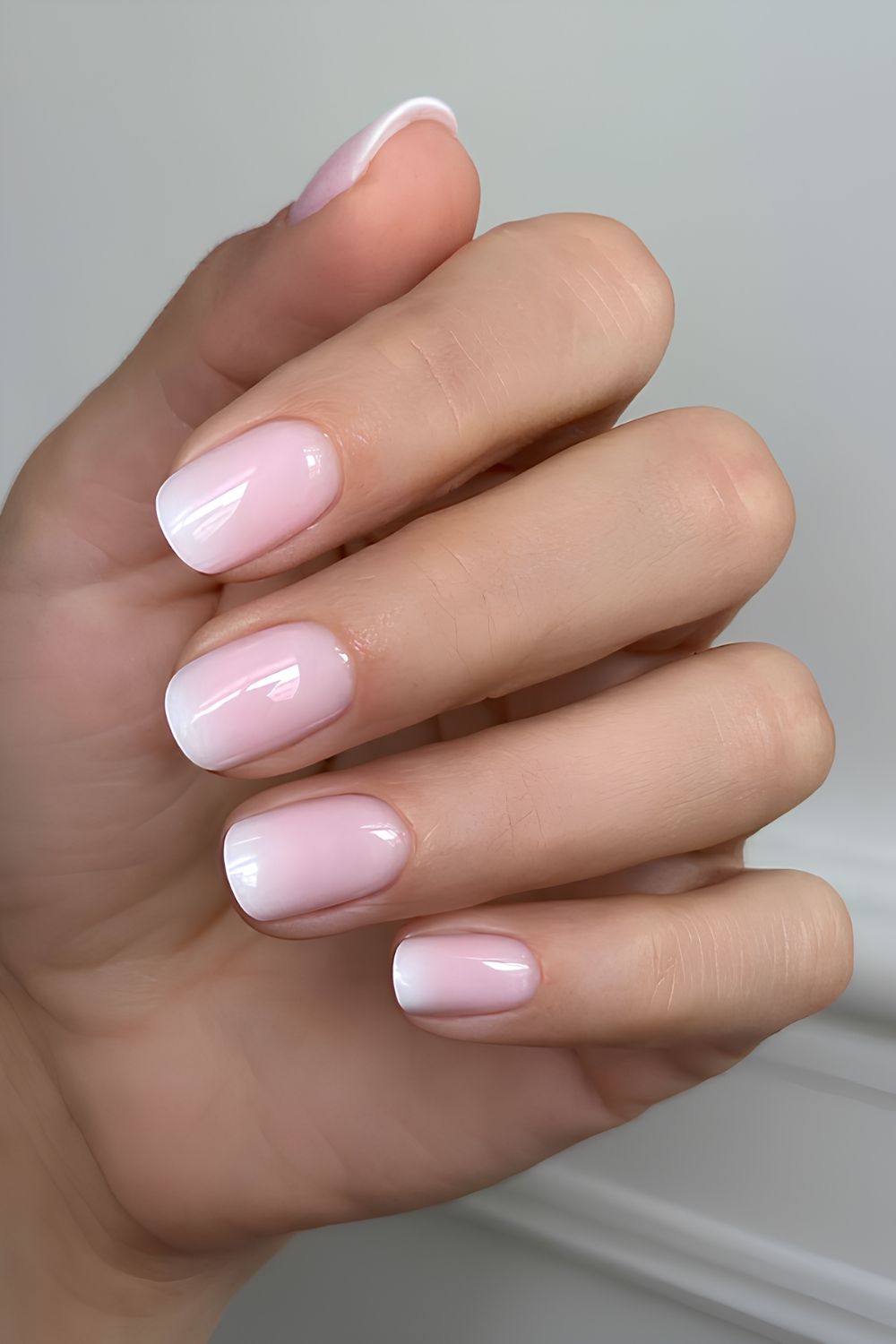 Soft pink to white ombre mani