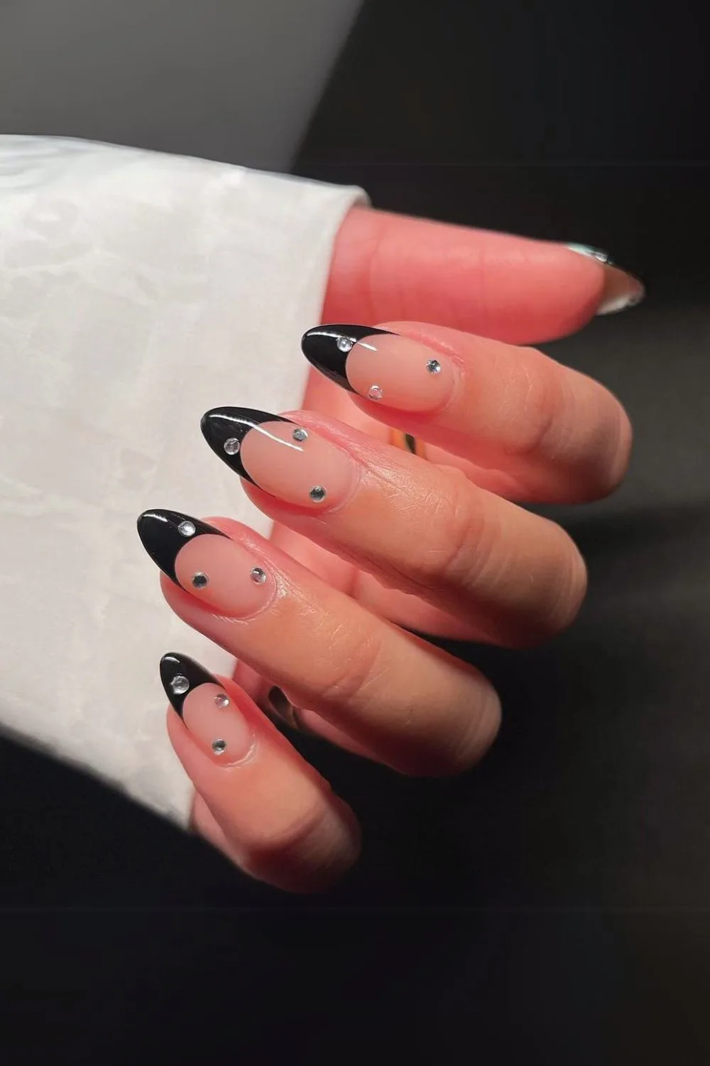 Studded black French tip manicure