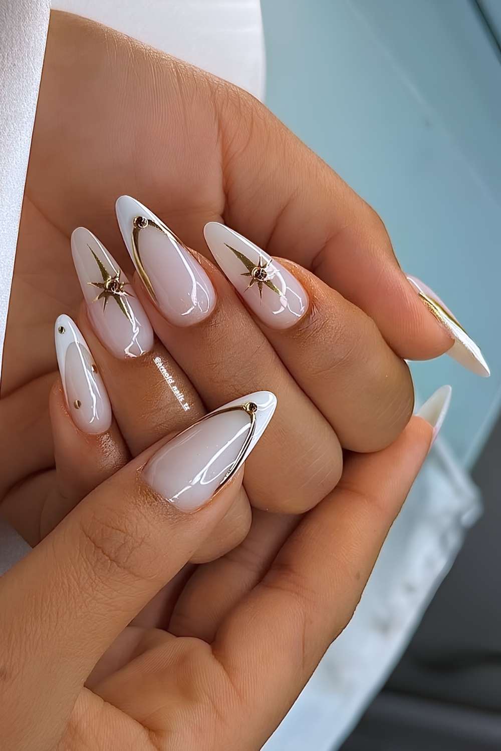 White French mani with celestial gold chrome accents