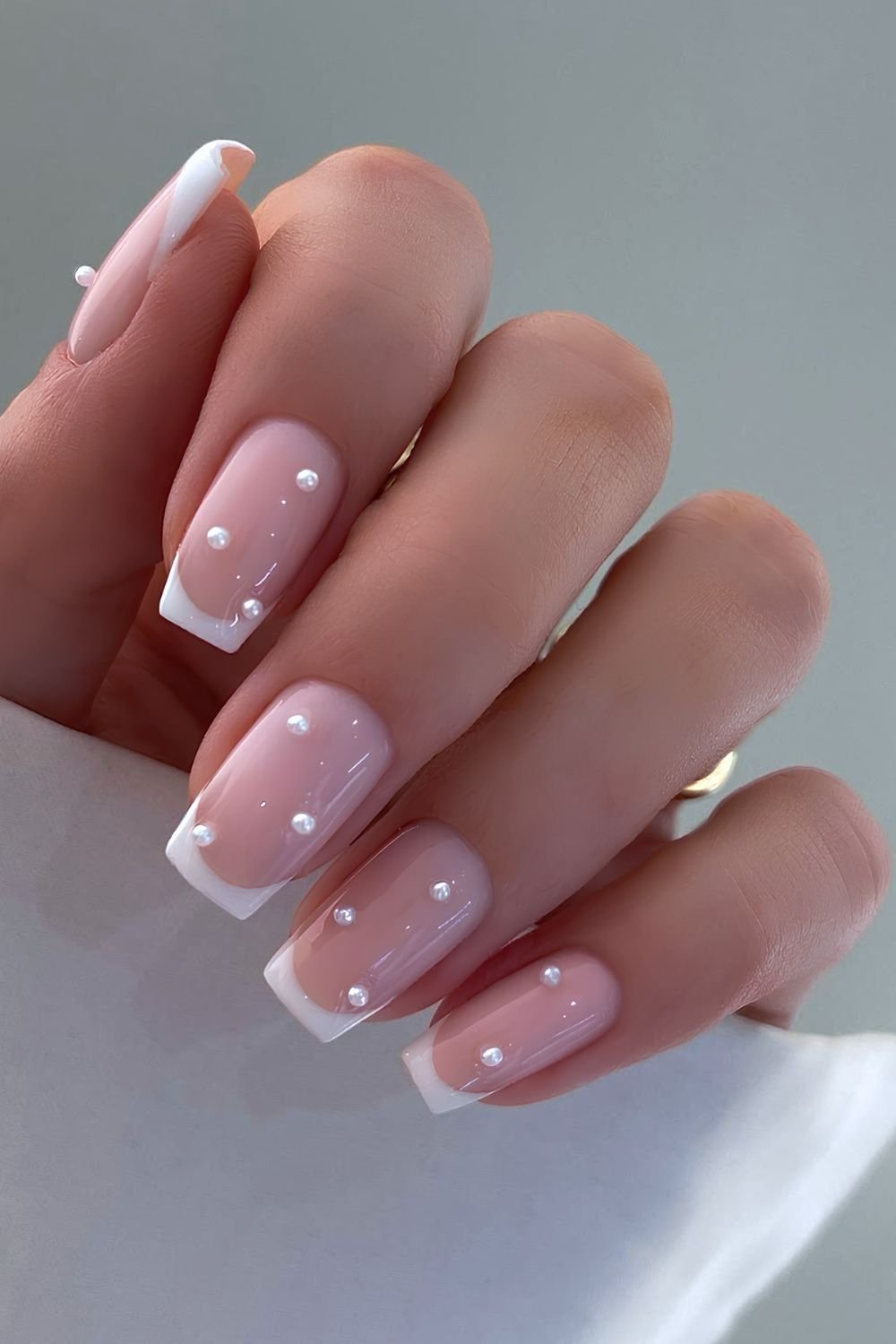 White French mani with pearl beads