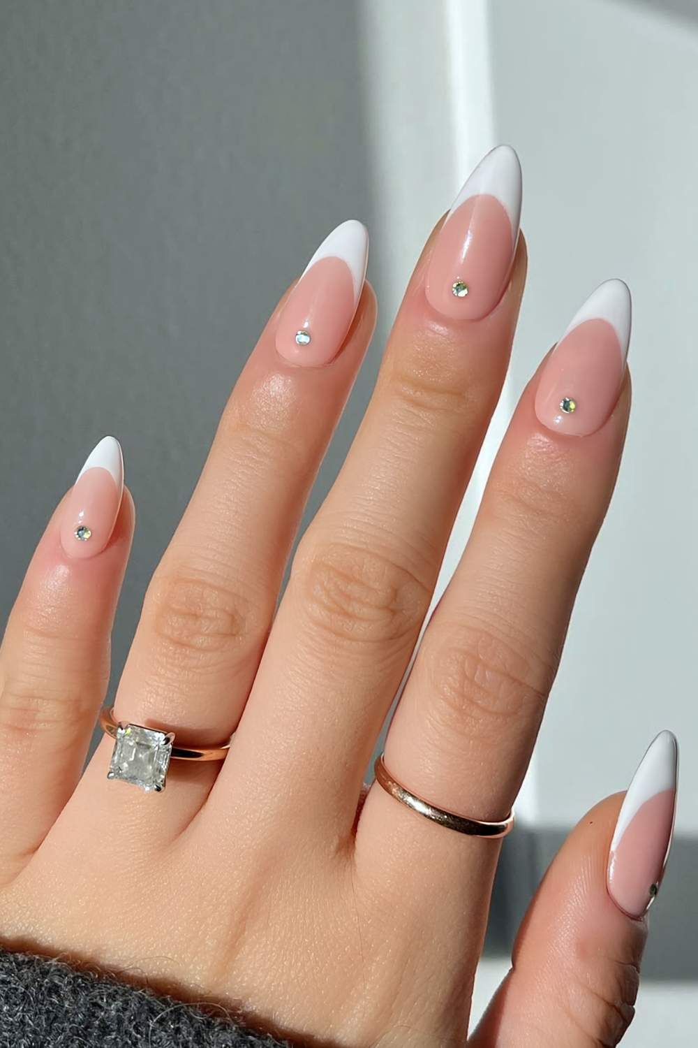 White French tip nails with cuticle rhinestones