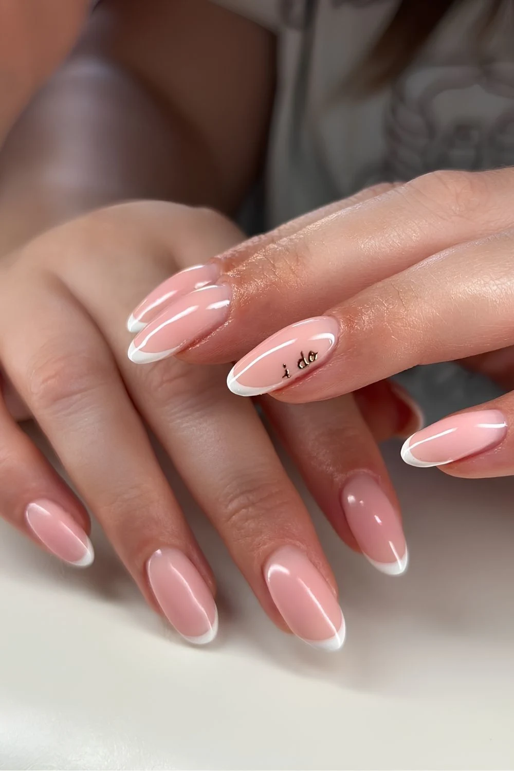 White french nails with i do text accent