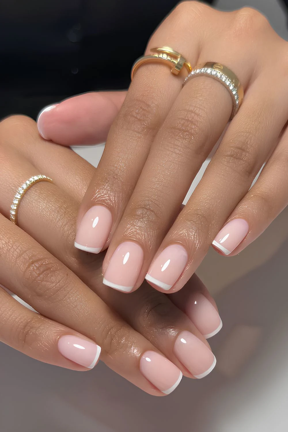 White micro French mani on milky pink base