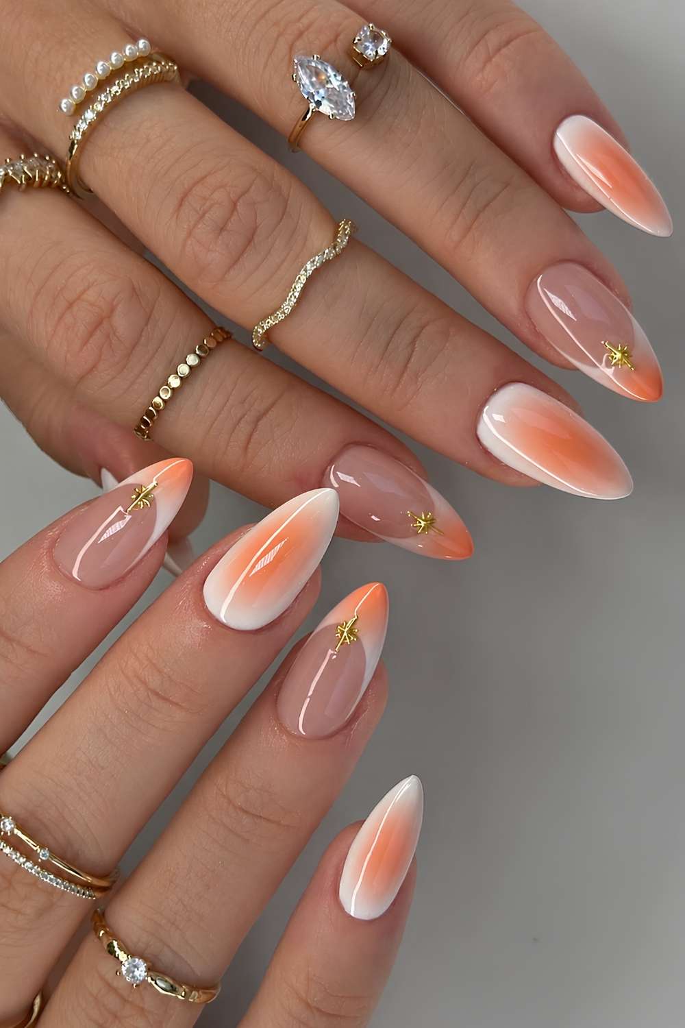White nails with orange aura shading