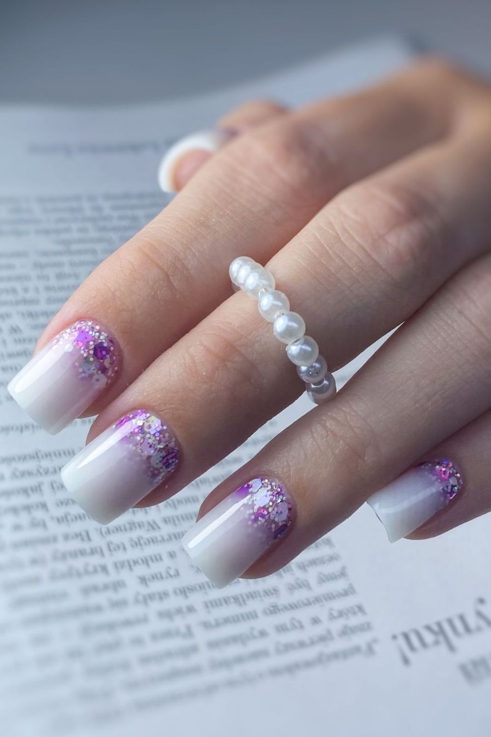 White nails with purple glitter