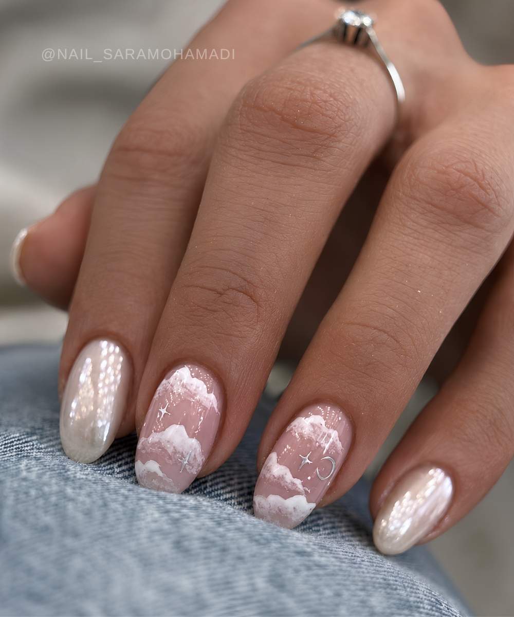 White pearl chrome nails with cloud art