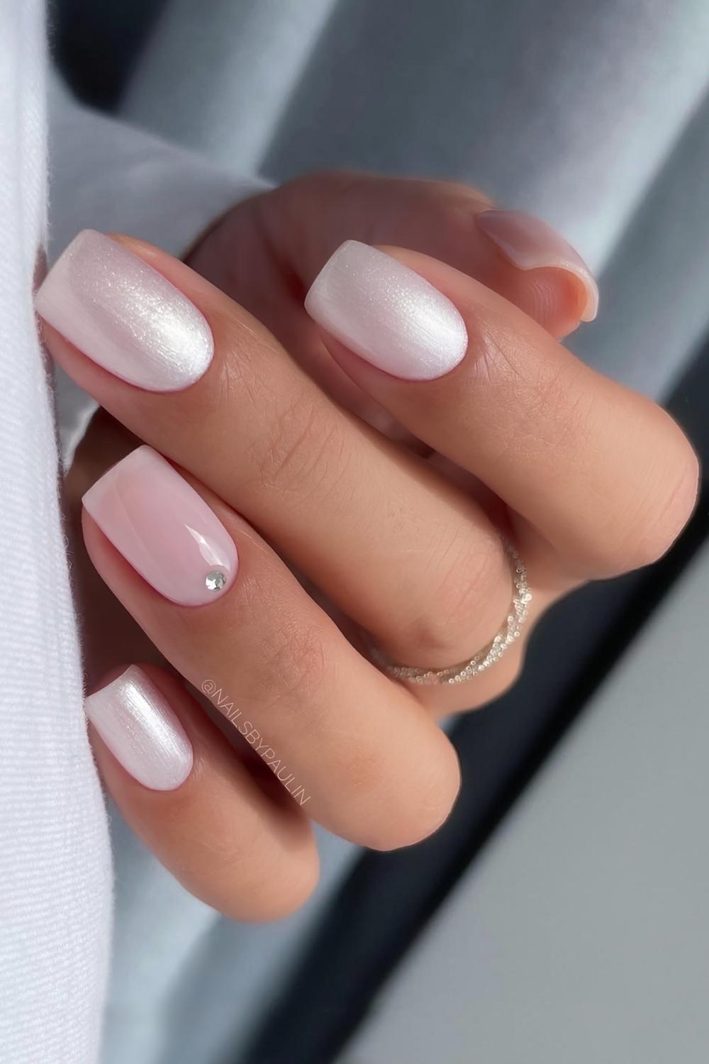 White satin nails with glossy pink accent