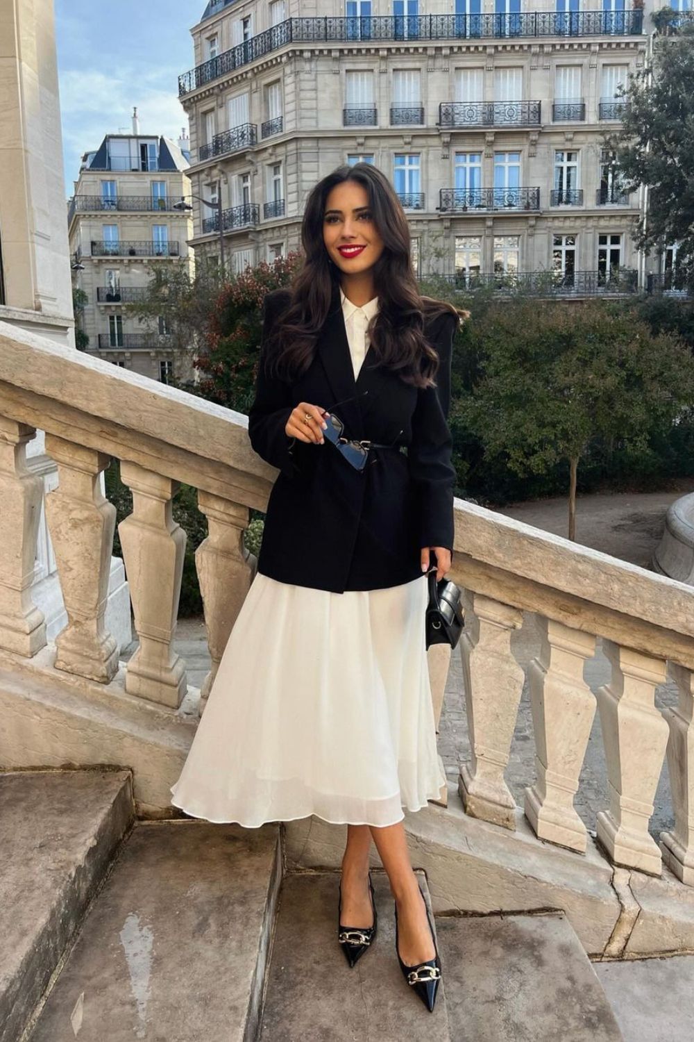 Woman in a blazer and skirt combo