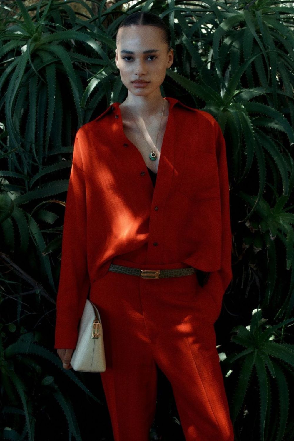 a model in a red suit