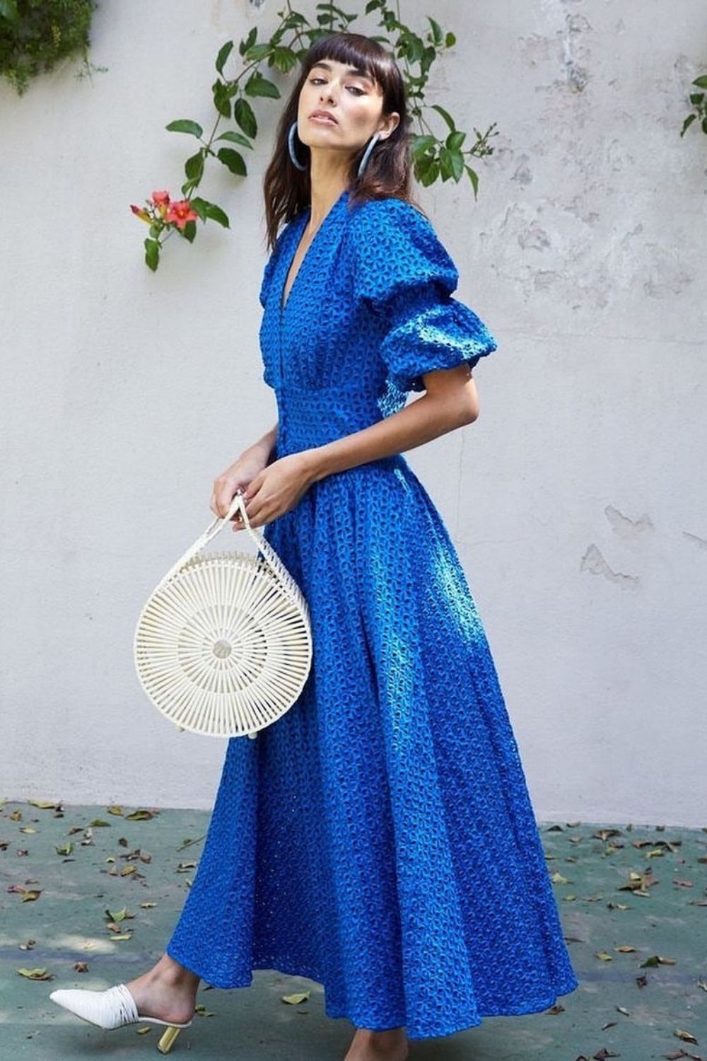 a model posing in a royal blue dress