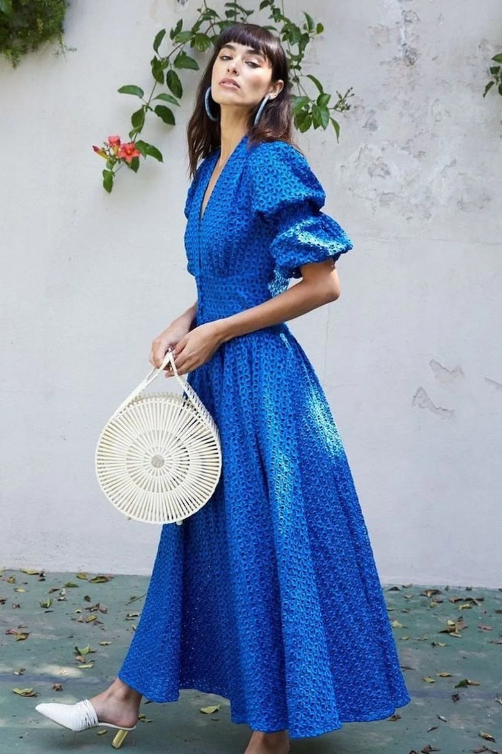 a model posing in a royal blue dress