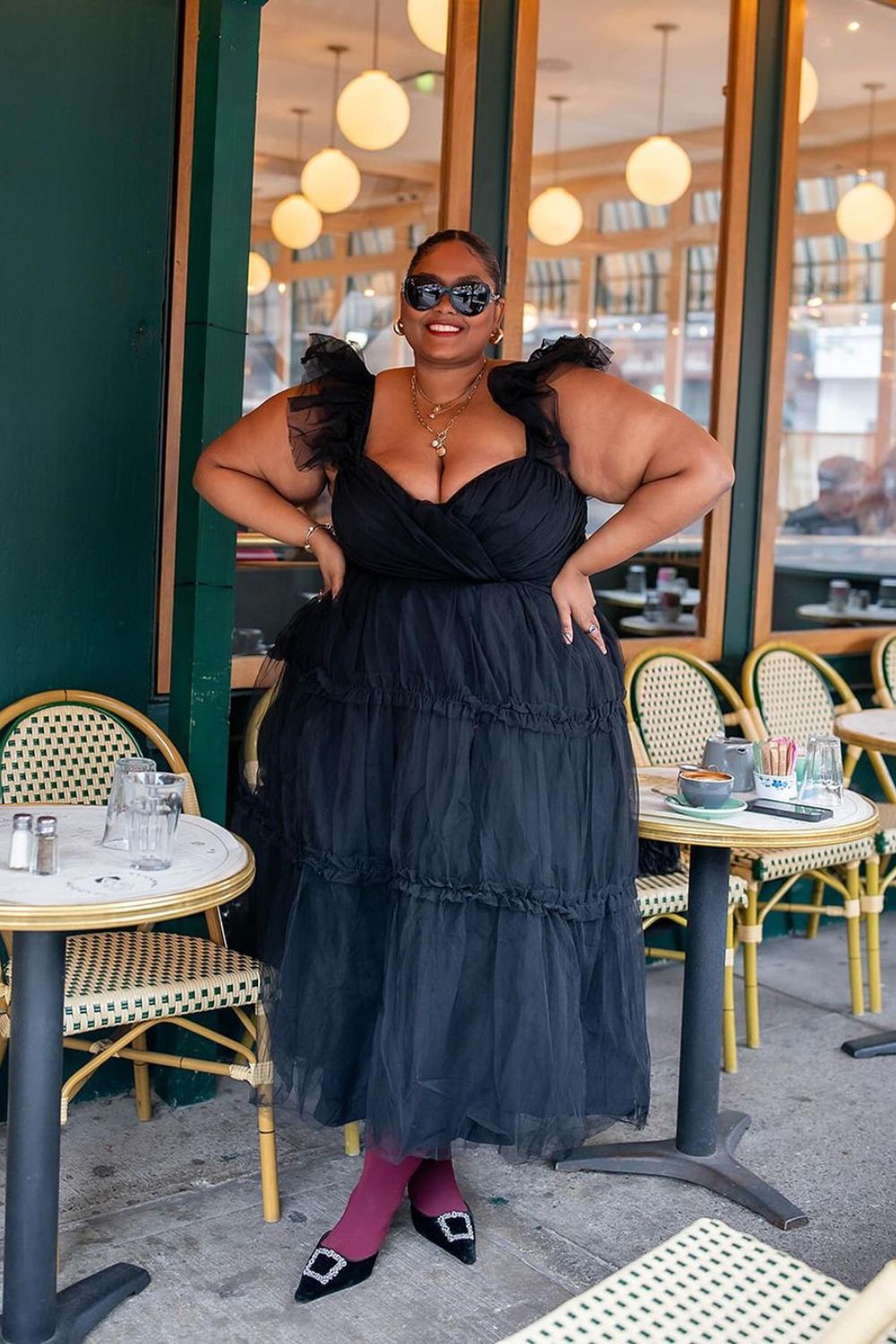 black dress on a plus size model