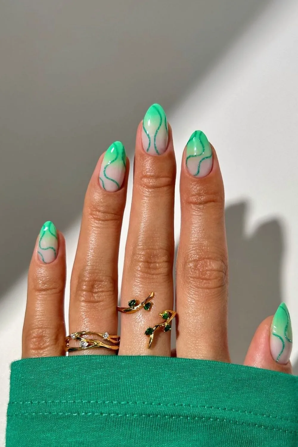 ombre nails with sparkly green swirlies 