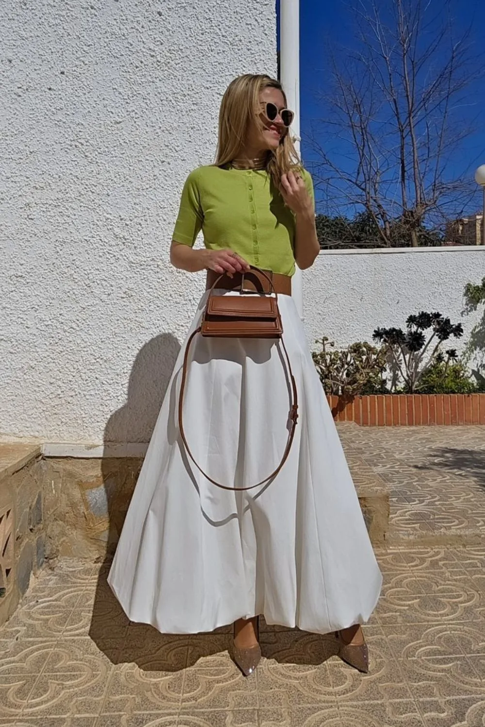 green top and white skirt