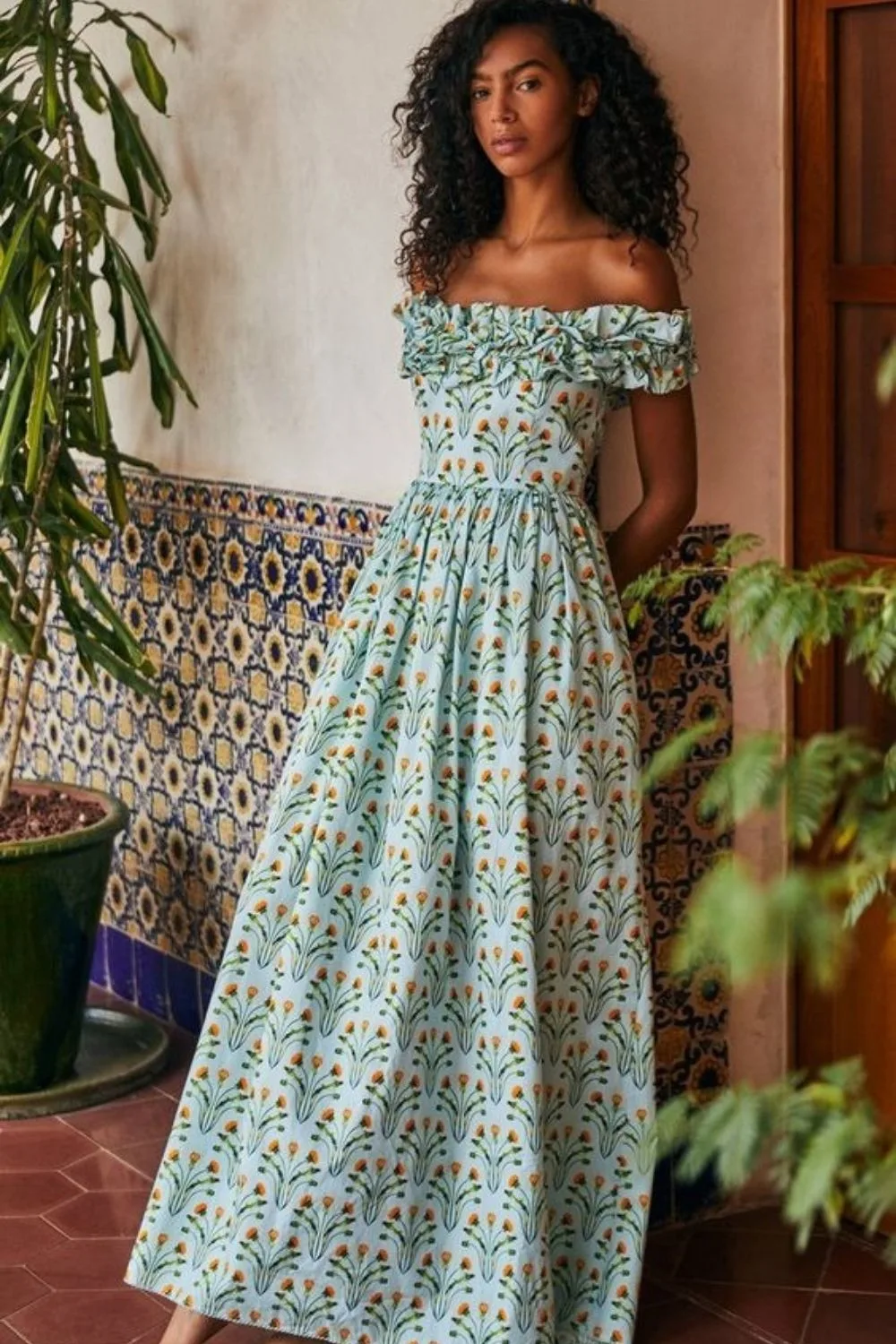 model posing in a patterned dress