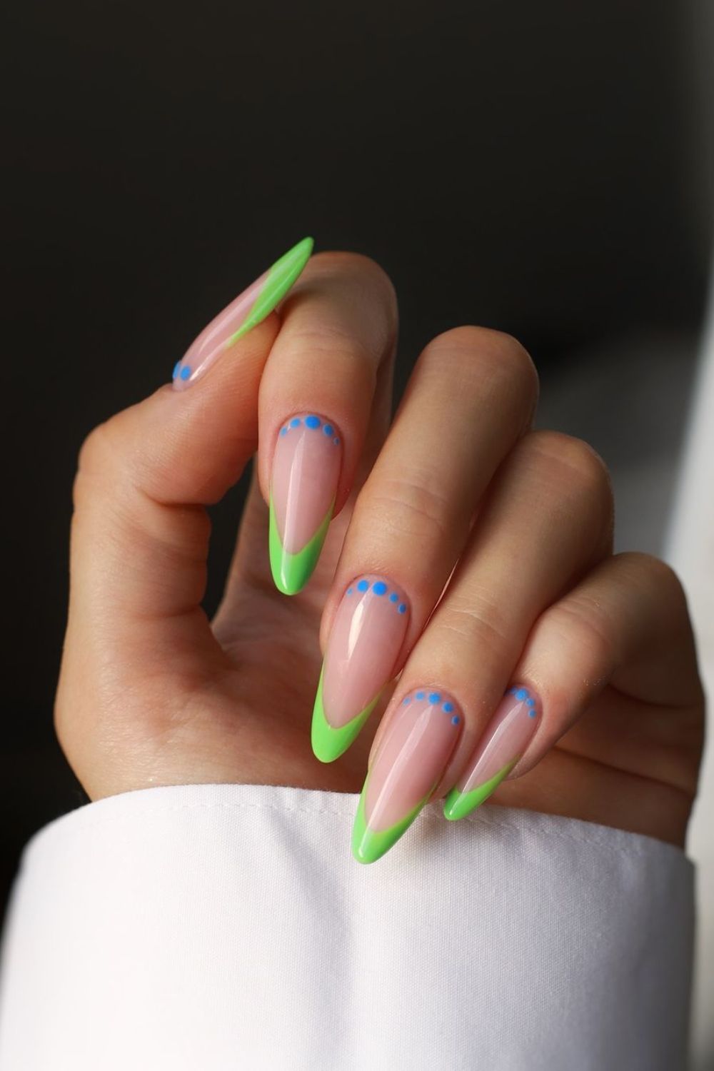 neon green french tips with blue dots