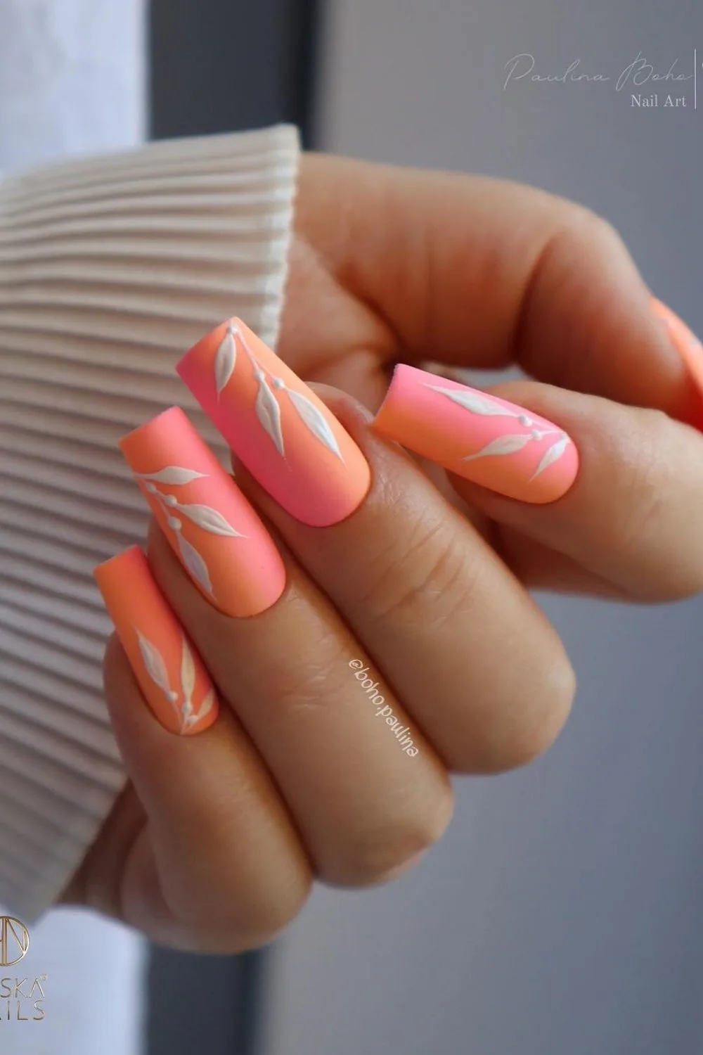 orange and pink nails with flowers