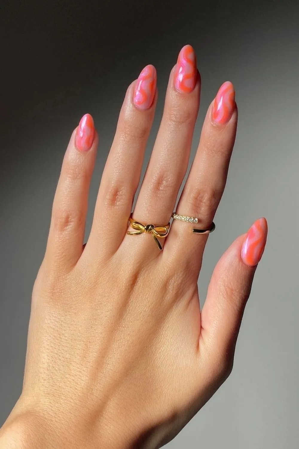 orange and pink swirl nails