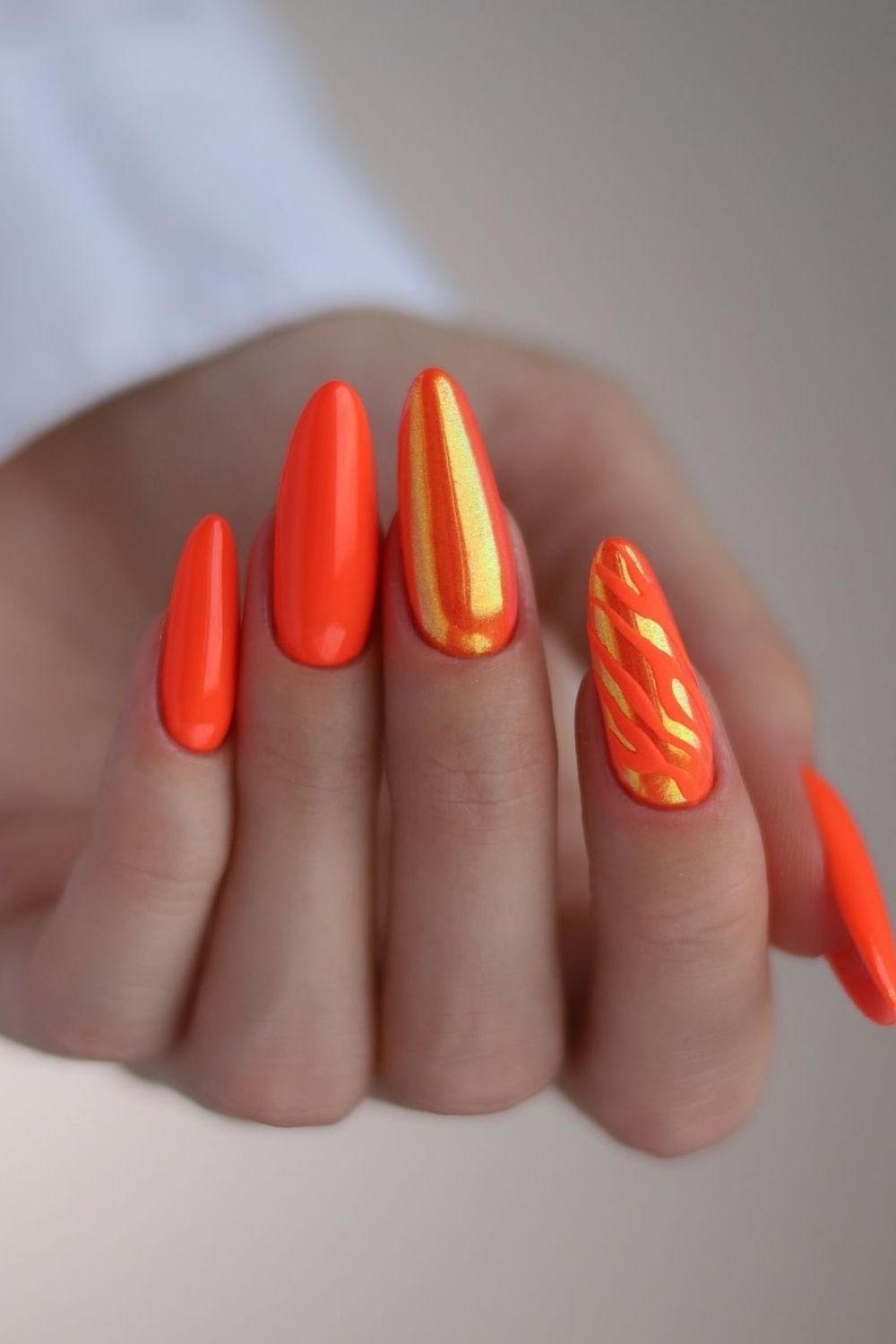 orange summer nails with shimmer