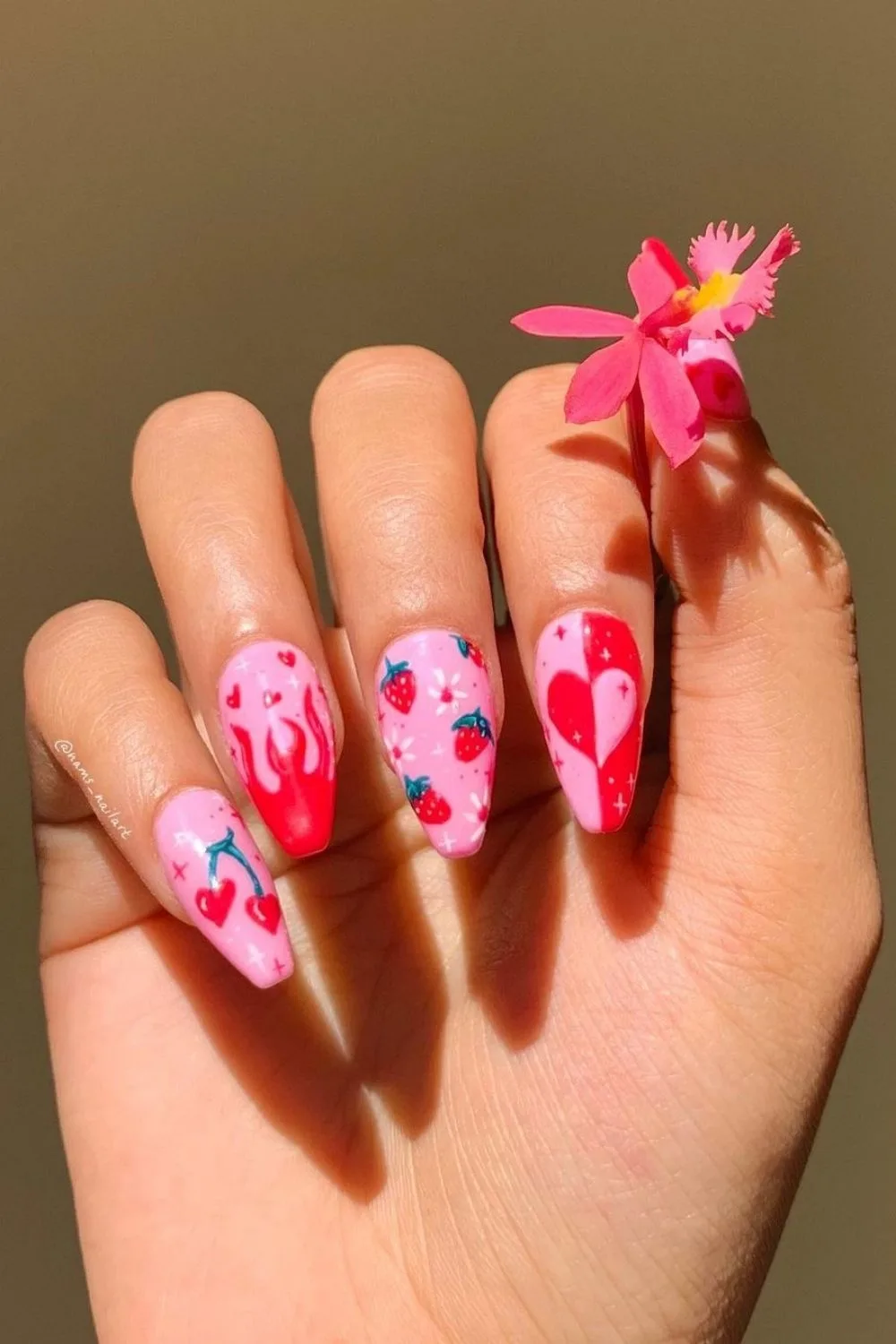 red and pink strawberry nails