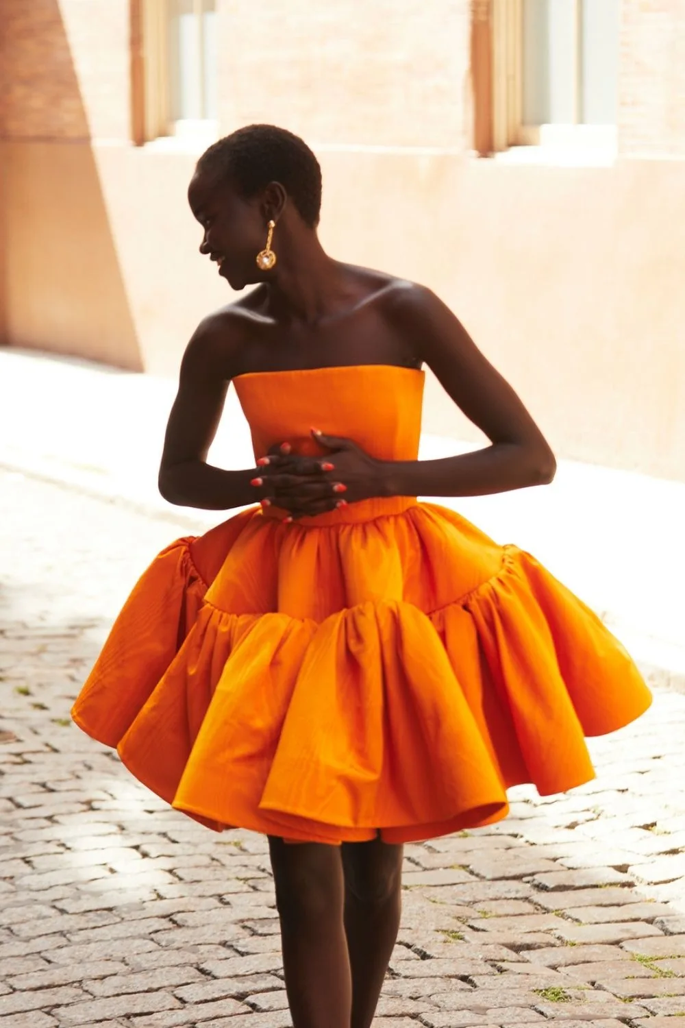 smiling woman in beautiful orange dress