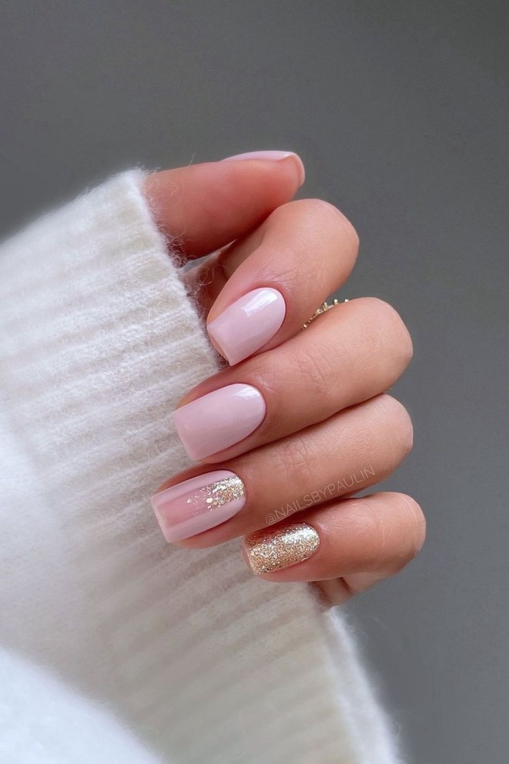 soft pink nails with golden sparkle